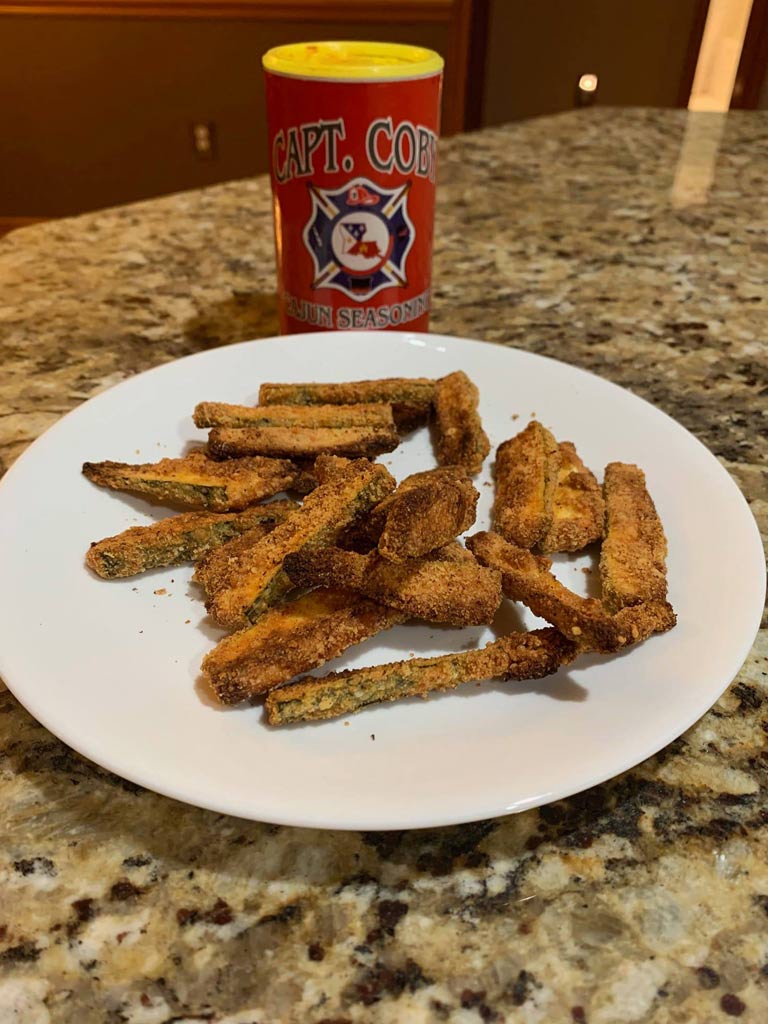 A plate of fried vegetables seasoned with Captain Coby's Cajun Seasoning