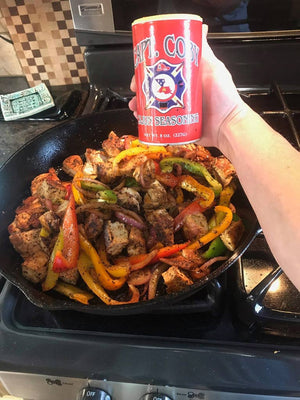 Load image into Gallery viewer, A pan of stir fried vegetables seasoned with Captain Coby&#39;s Cajun Seasoning
